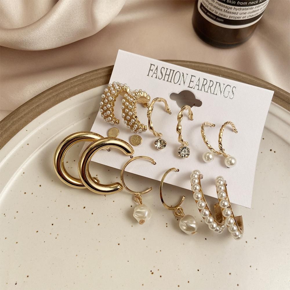 Set of 09 Stunning Gold Plated Pearl Studs and Hoop Earrings